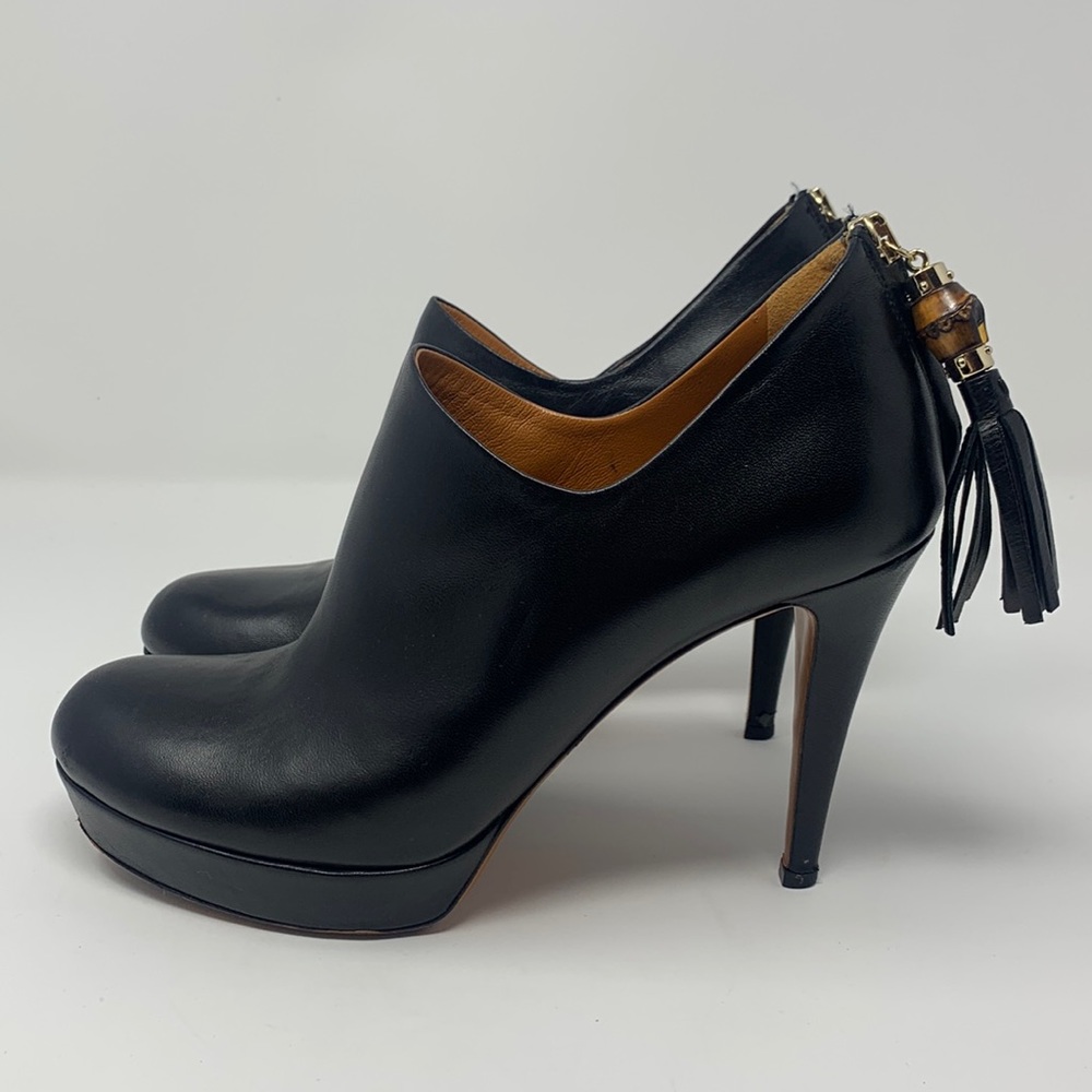 Iconic Gucci ankle boots with bamboo charm at the zippers